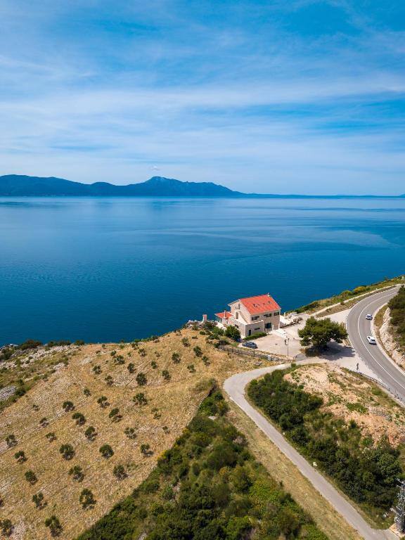 Aerial view of Galeb Bed and Breakfast above the Adriatic coast road
